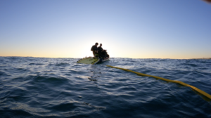 big wave tow in foil surfing