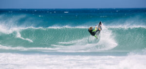 kitesurfing on a carbon kiteboard in waves in Cape Town